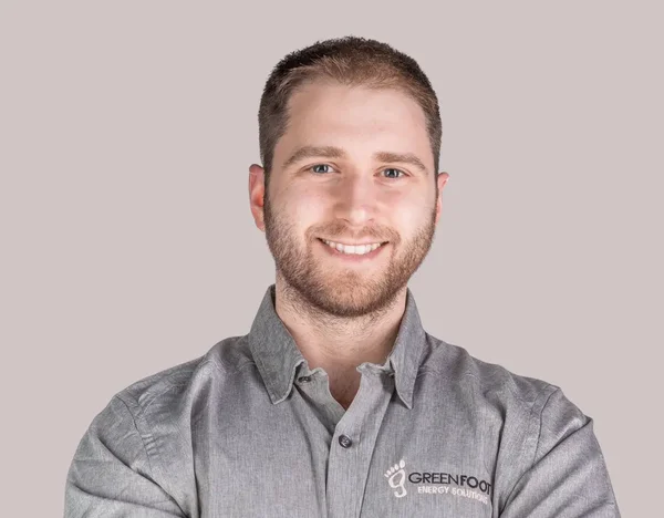 Happy homeowner satisfied with new energy efficient HVAC system